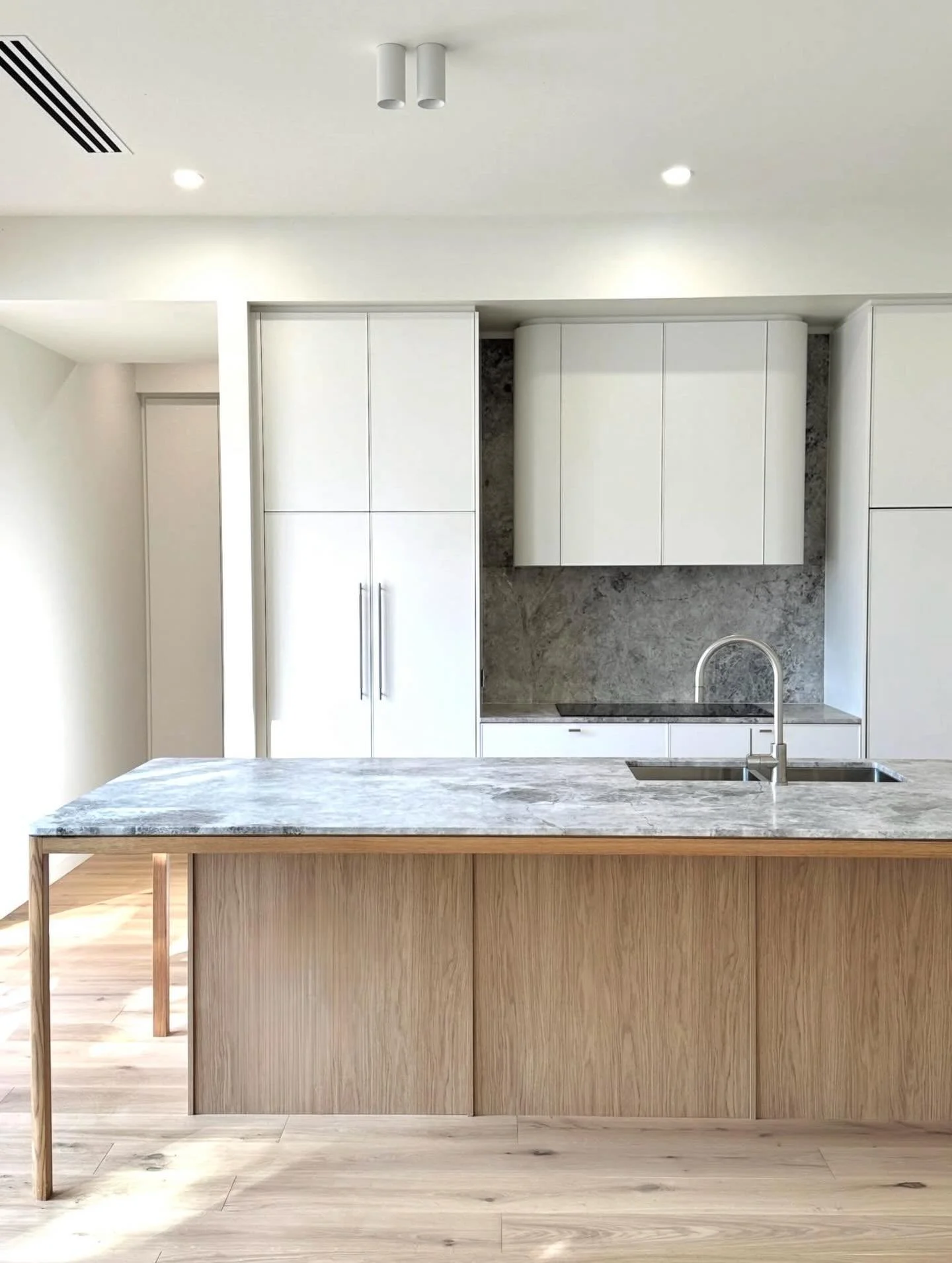 A kitchen designed to be the heart of the home.

This bespoke Tanunda residence combines warm timber tones, natural stone, and refined detailing to create a space that&rsquo;s both functional and timeless.

Build @bishop_building 
Architect + Design 