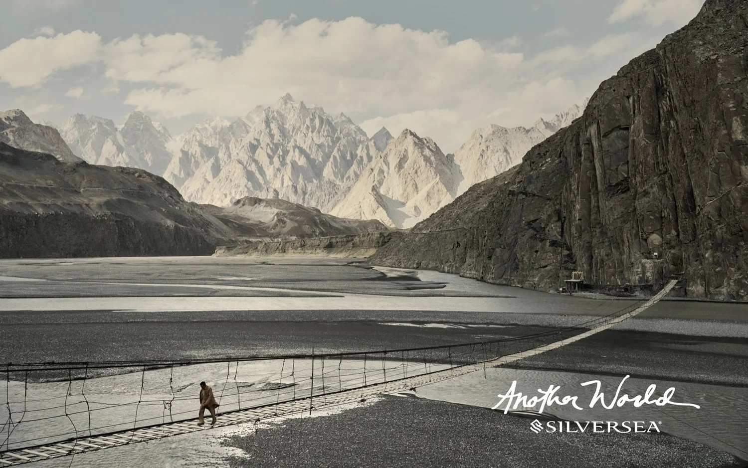 Silversea: a lone traveller beneath snowy peaks
