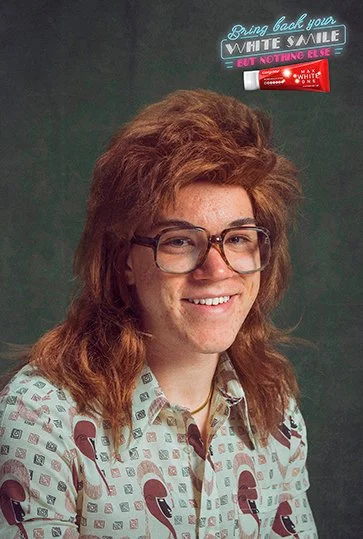 Retro school portrait with glasses and a white smile
