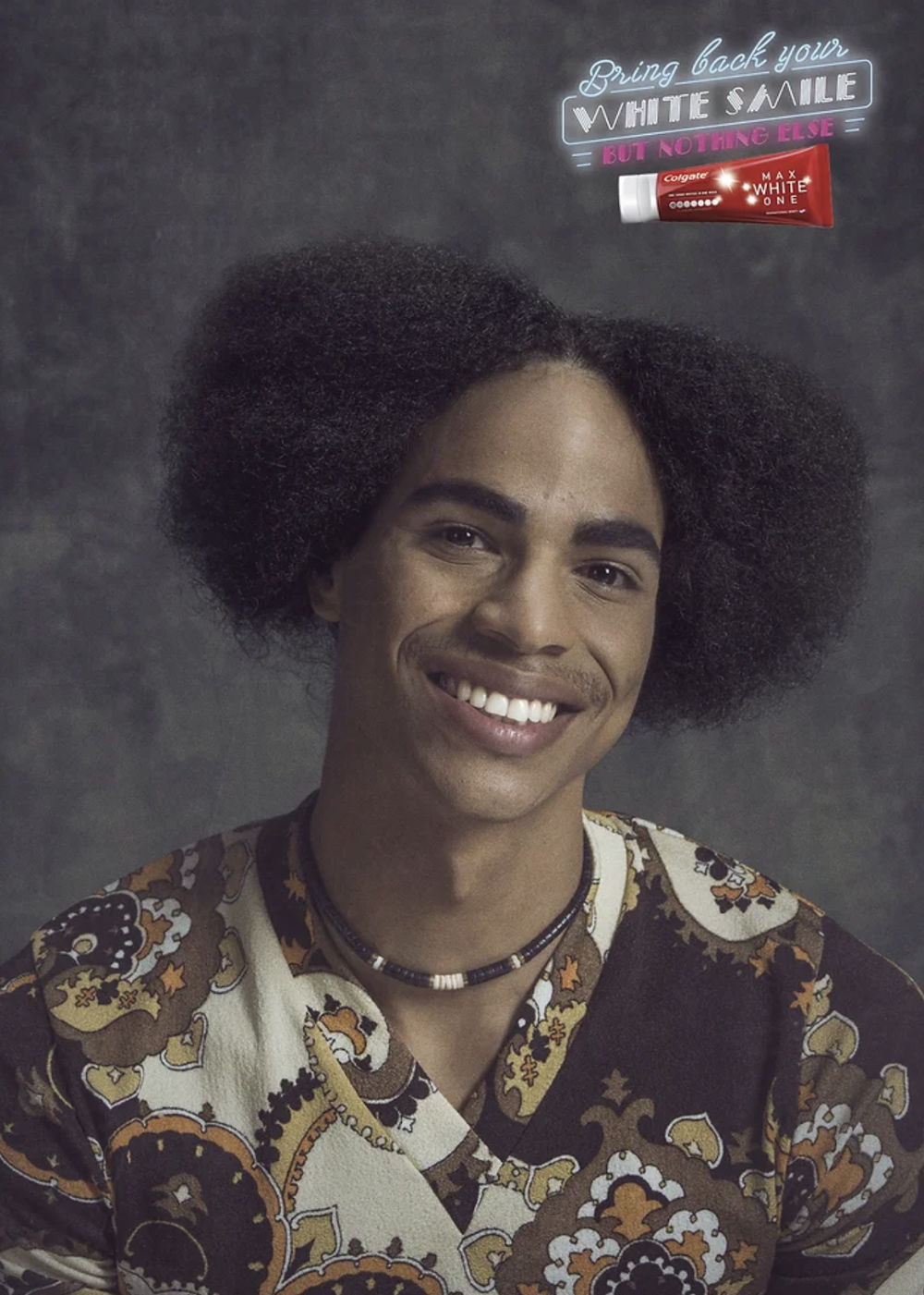 Colgate Max White: woman with big eighties hair and a bright white smile