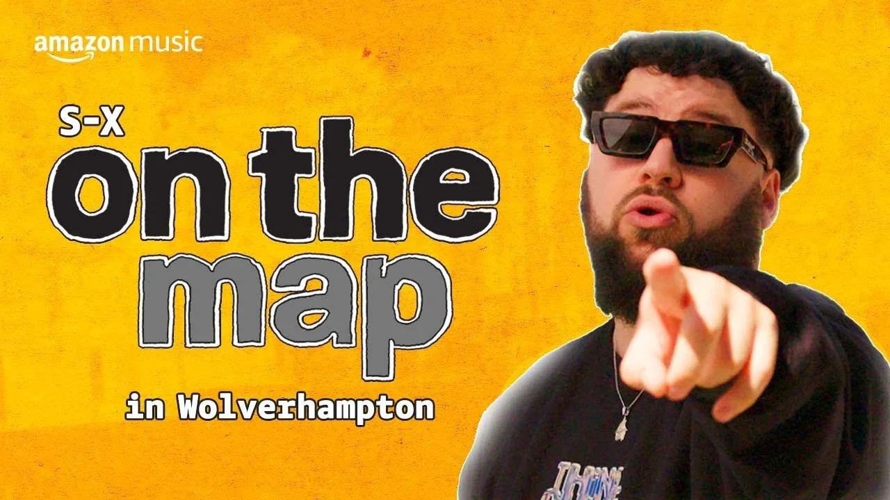 A promotional poster for Amazon Music featuring a man with sunglasses pointing towards the camera, with text that reads "S-X on the map in Wolverhampton" on a yellow background.