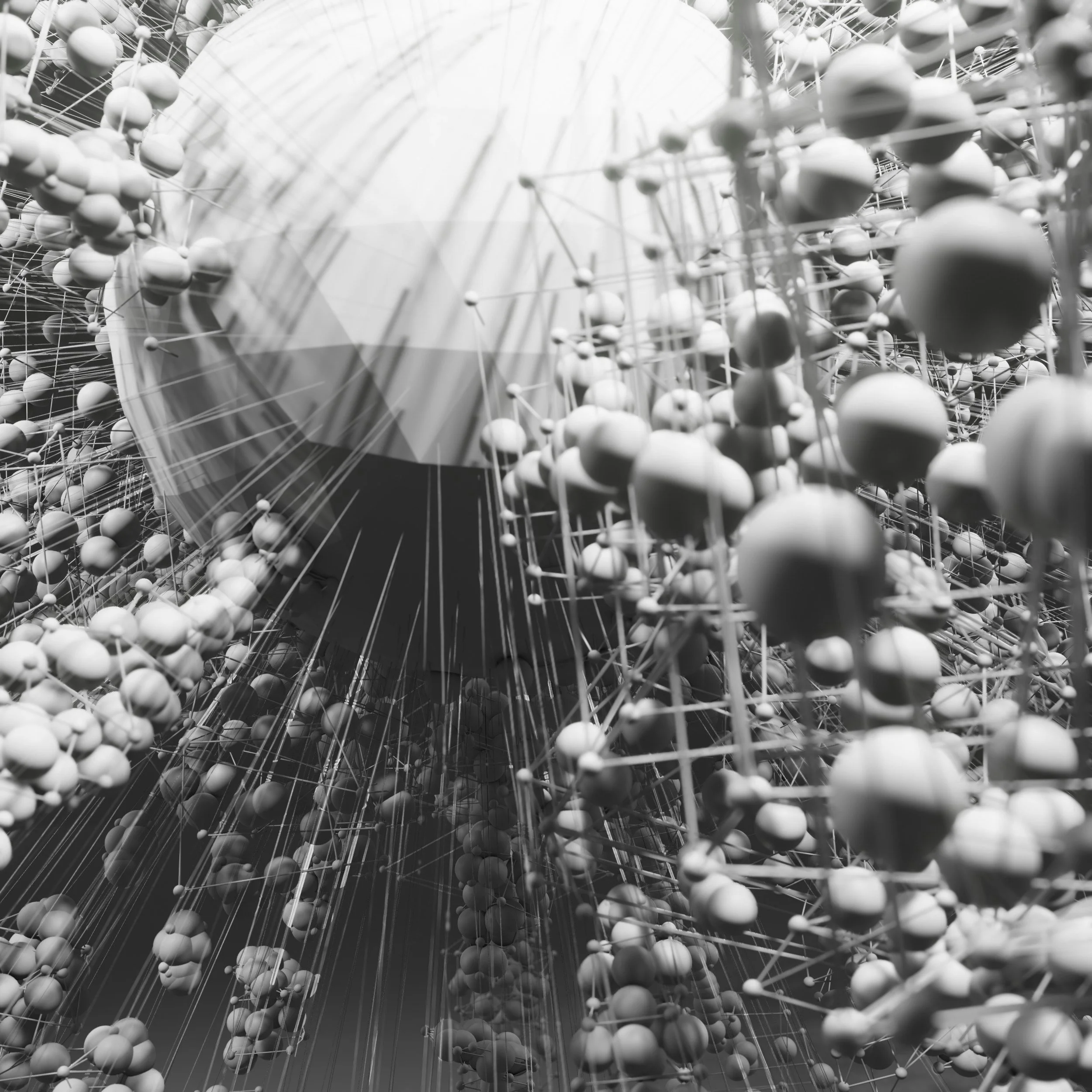 A close-up black-and-white photo of an abstract art installation with numerous spherical objects connected by thin rods and strings, creating a complex, web-like structure.