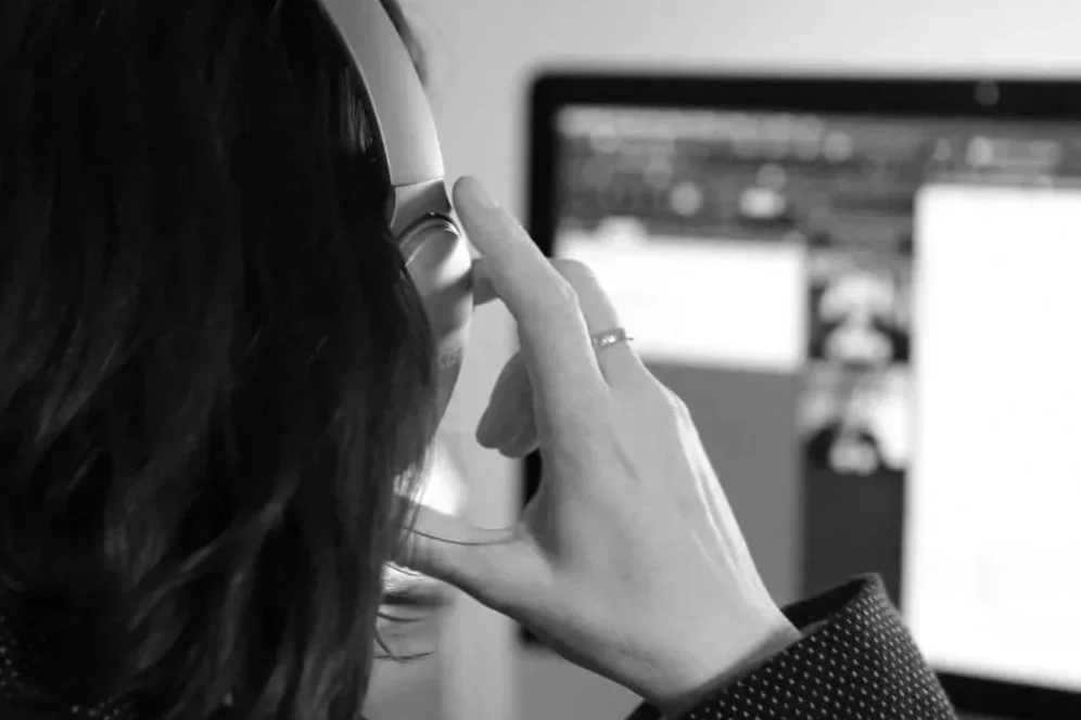 English teacher for LGBT students Tree putting on headphones ready to teach English online