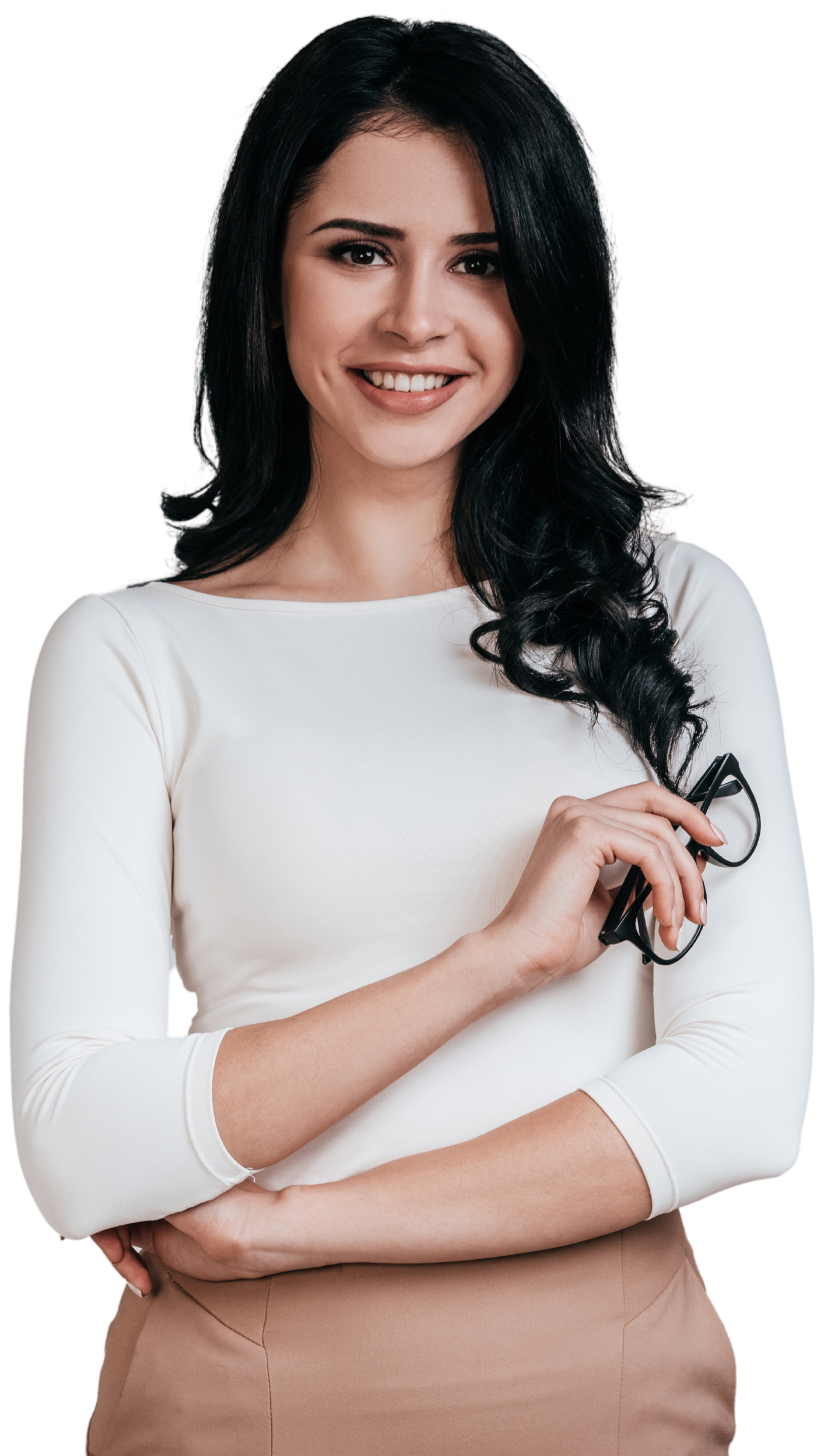 A woman with long black hair in a white long-sleeve top holding a pair of glasses, smiling against a black background.