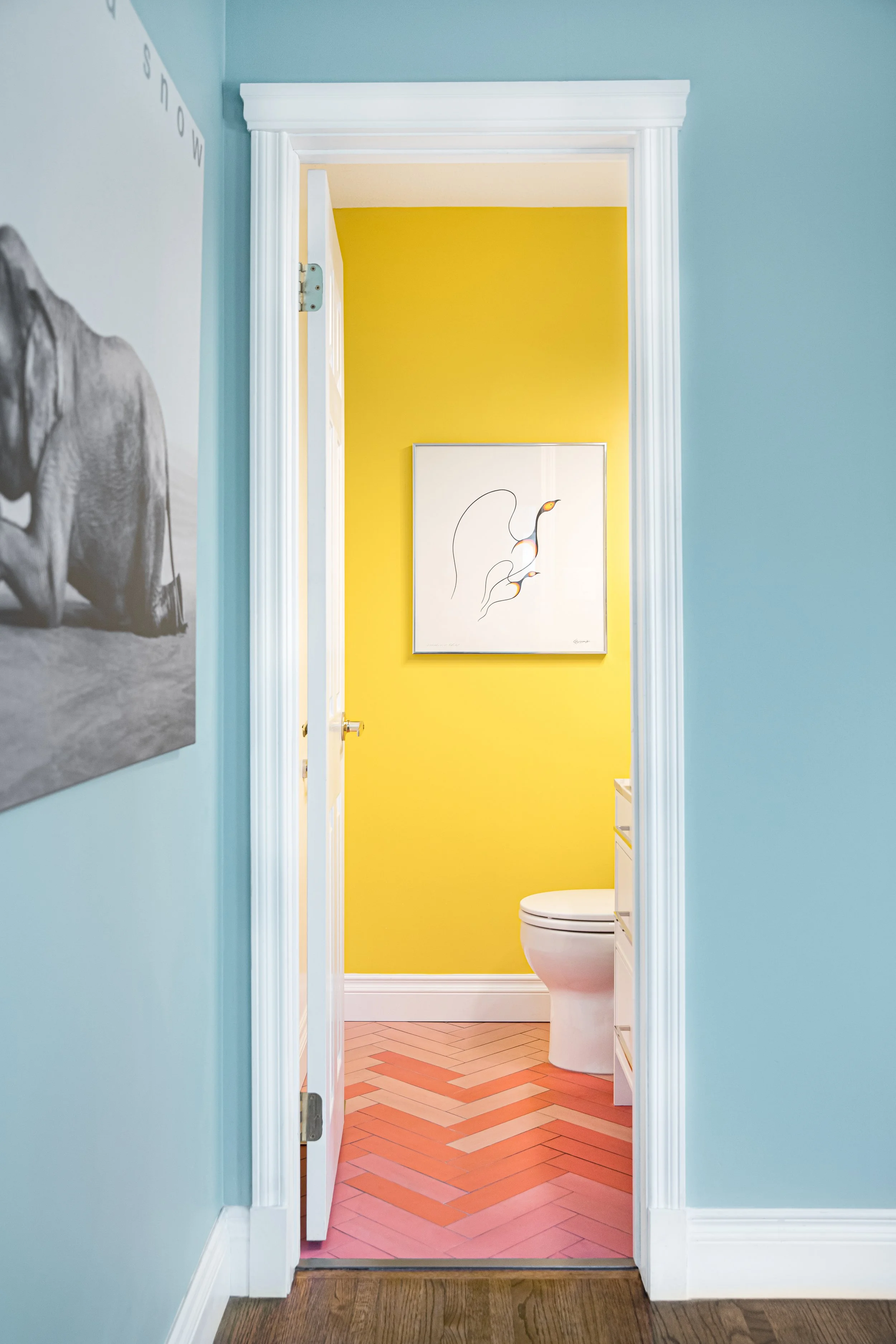 Vibrant Yellow Bathroom with Chevron Tile Flooring | Maple Ridge Art House Renovation