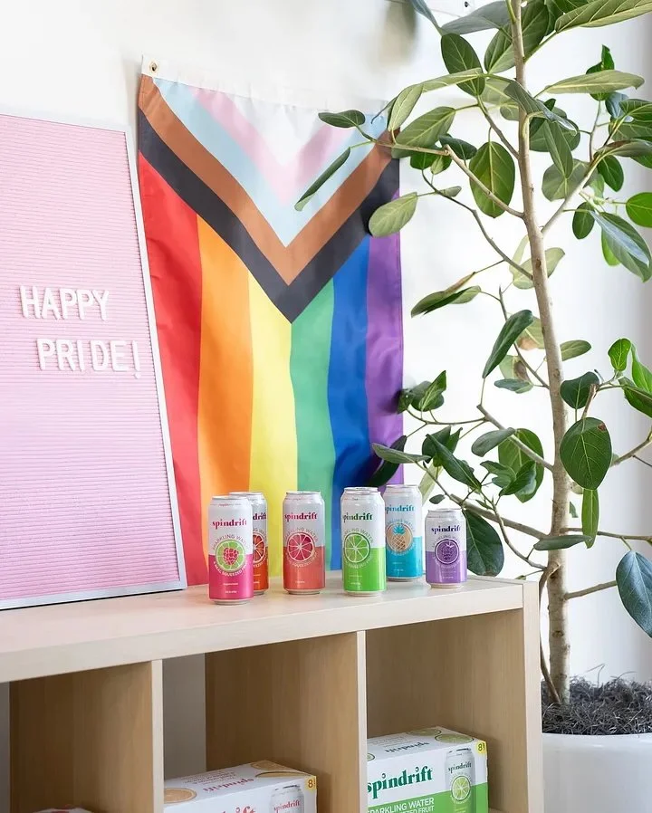  Two images side-by-side, each of six cans of spindrift. In the first, the colors of the cans are, in order, pink, peach, orange, green, blue, turquoise. In the second, the colors are, in order, pink, orange, peach, green, turquoise, purple. The purp