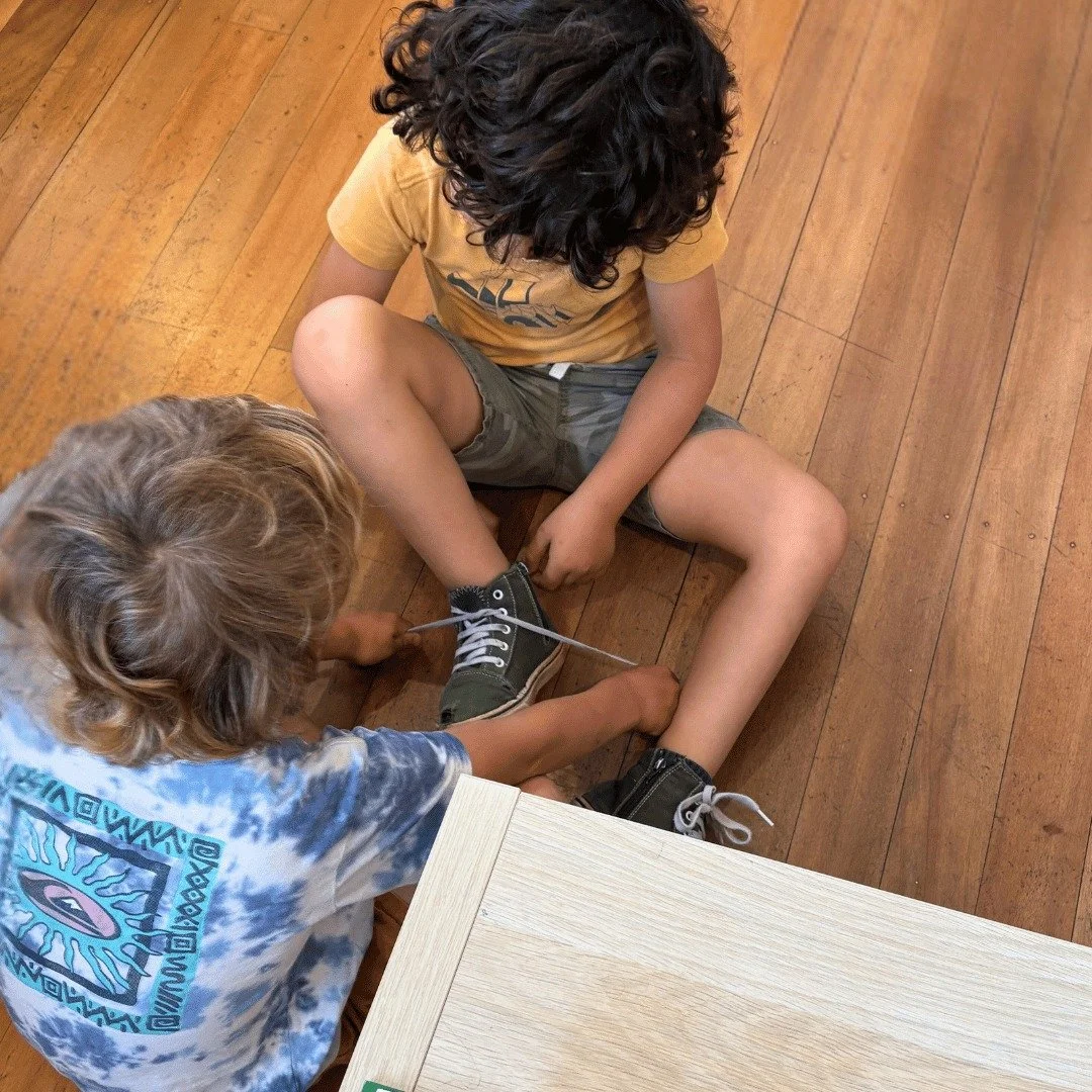 In Montessori, learning isn&rsquo;t top-down &mdash; it&rsquo;s shared.
One child&rsquo;s mastery becomes another&rsquo;s inspiration in the mixed-age classrooms. 
When a child teaches a peer &mdash; like showing how to tie a shoe &mdash; they&rsquo;