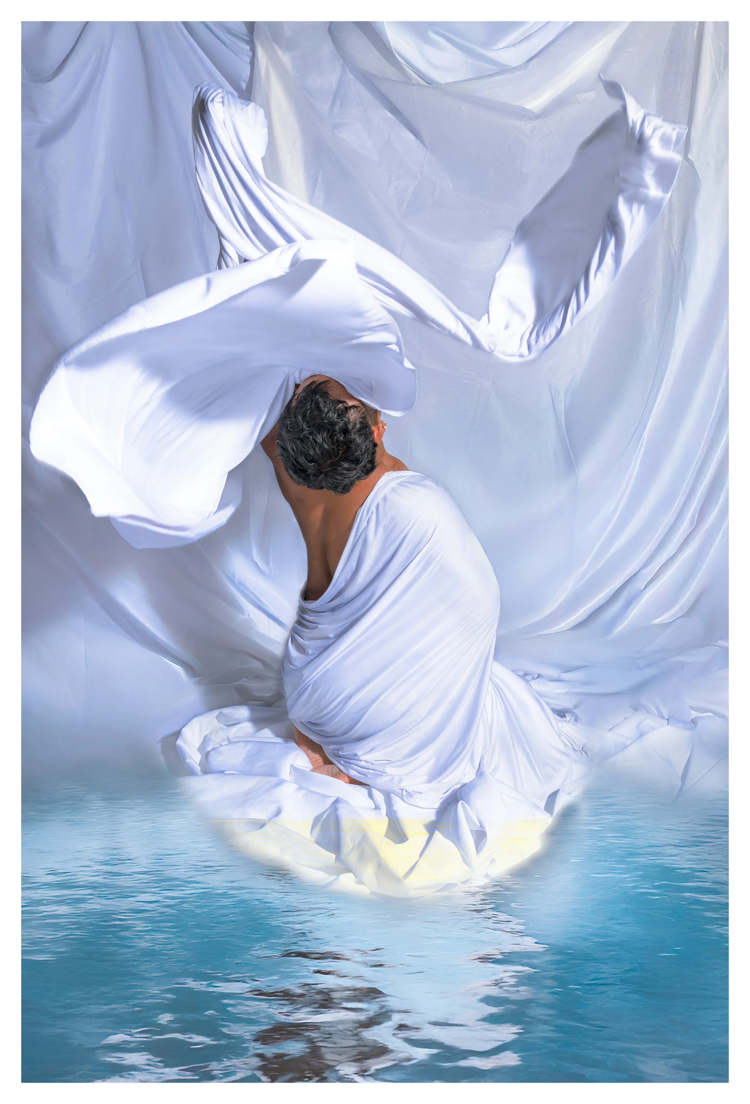 A person wrapped in white fabric appears to be emerging from or floating above a body of water, with white drapery and fabric surrounding them.