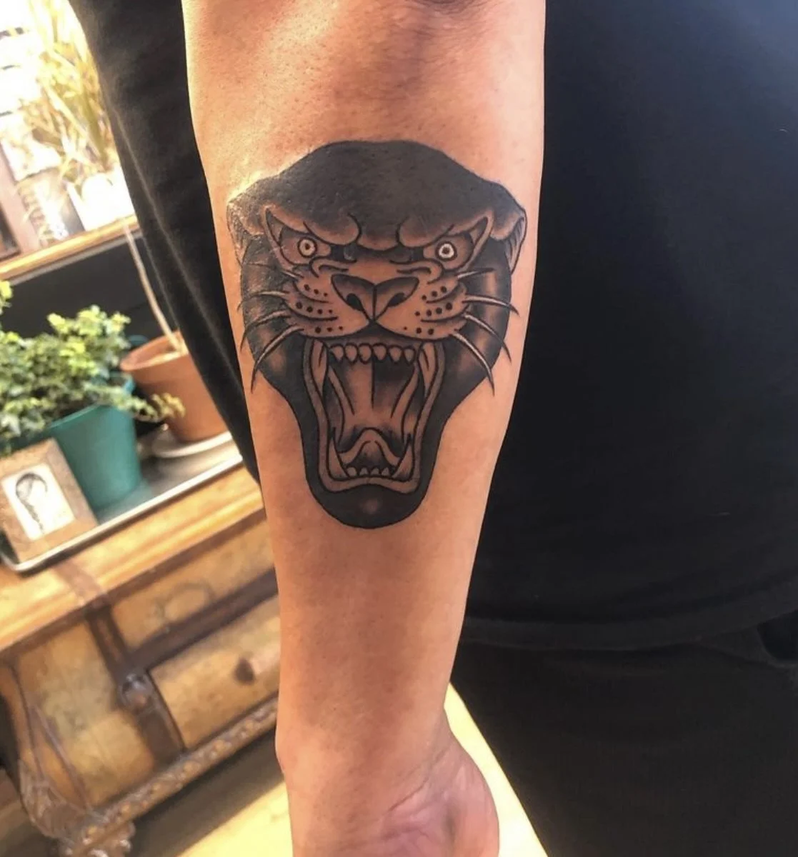 traditional panther tattoo.jpeg