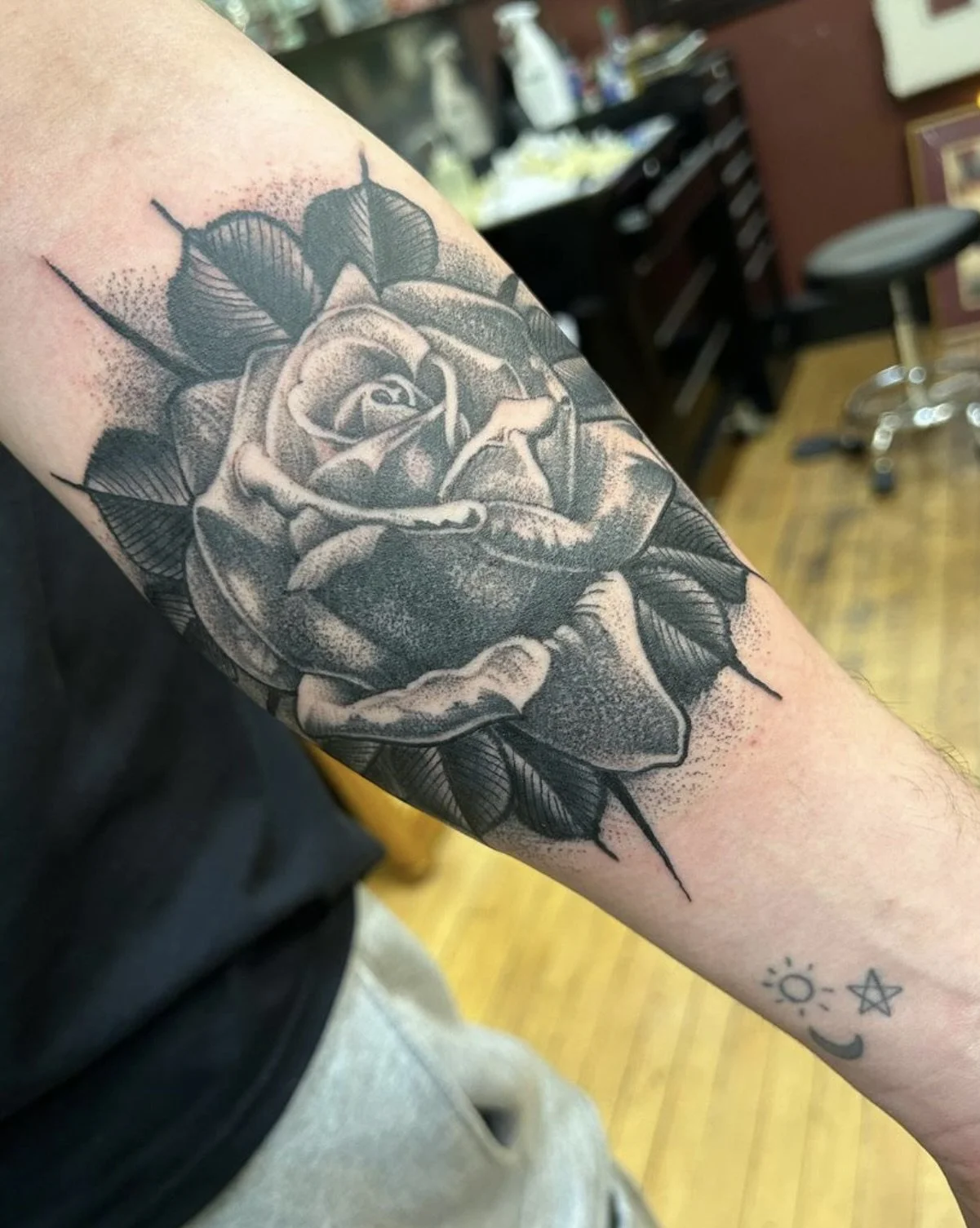 black and grey rose tattoo.jpeg
