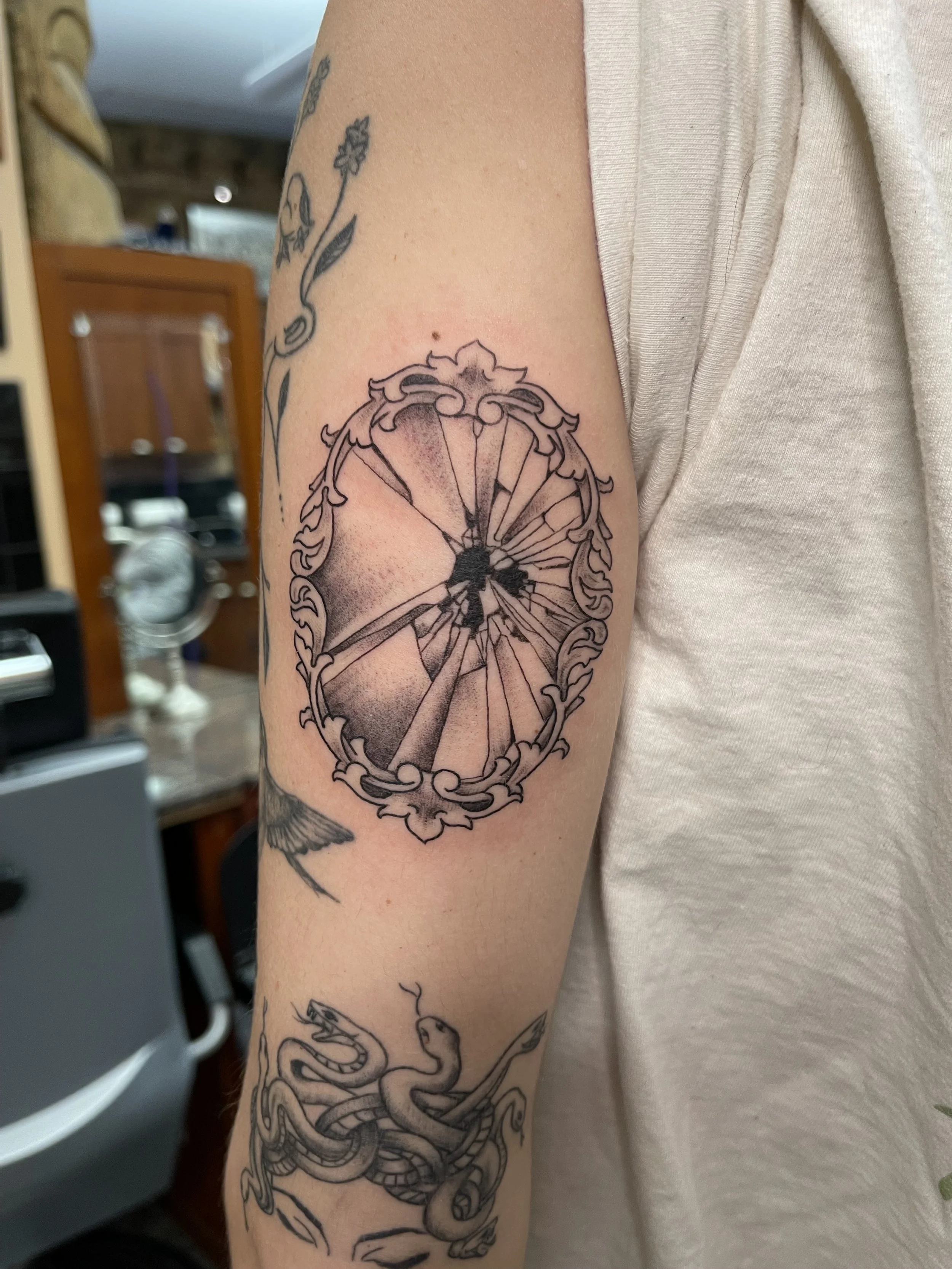 broken mirror tattoo.jpeg