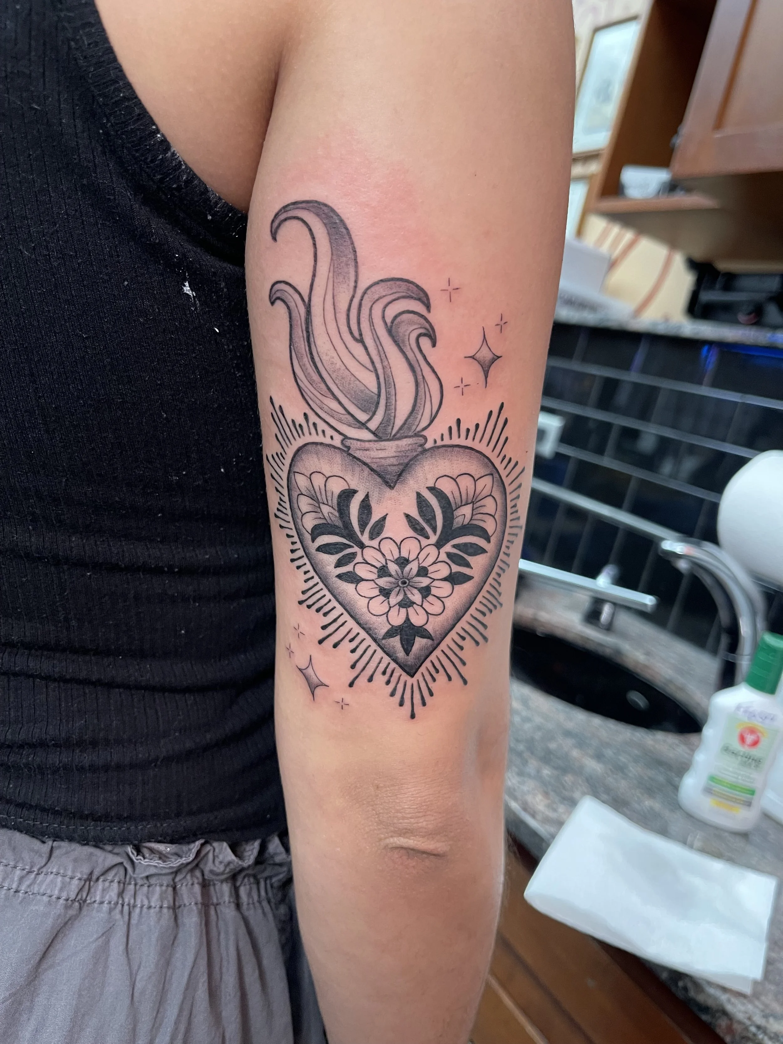 burning heart fine line tattoo.jpeg
