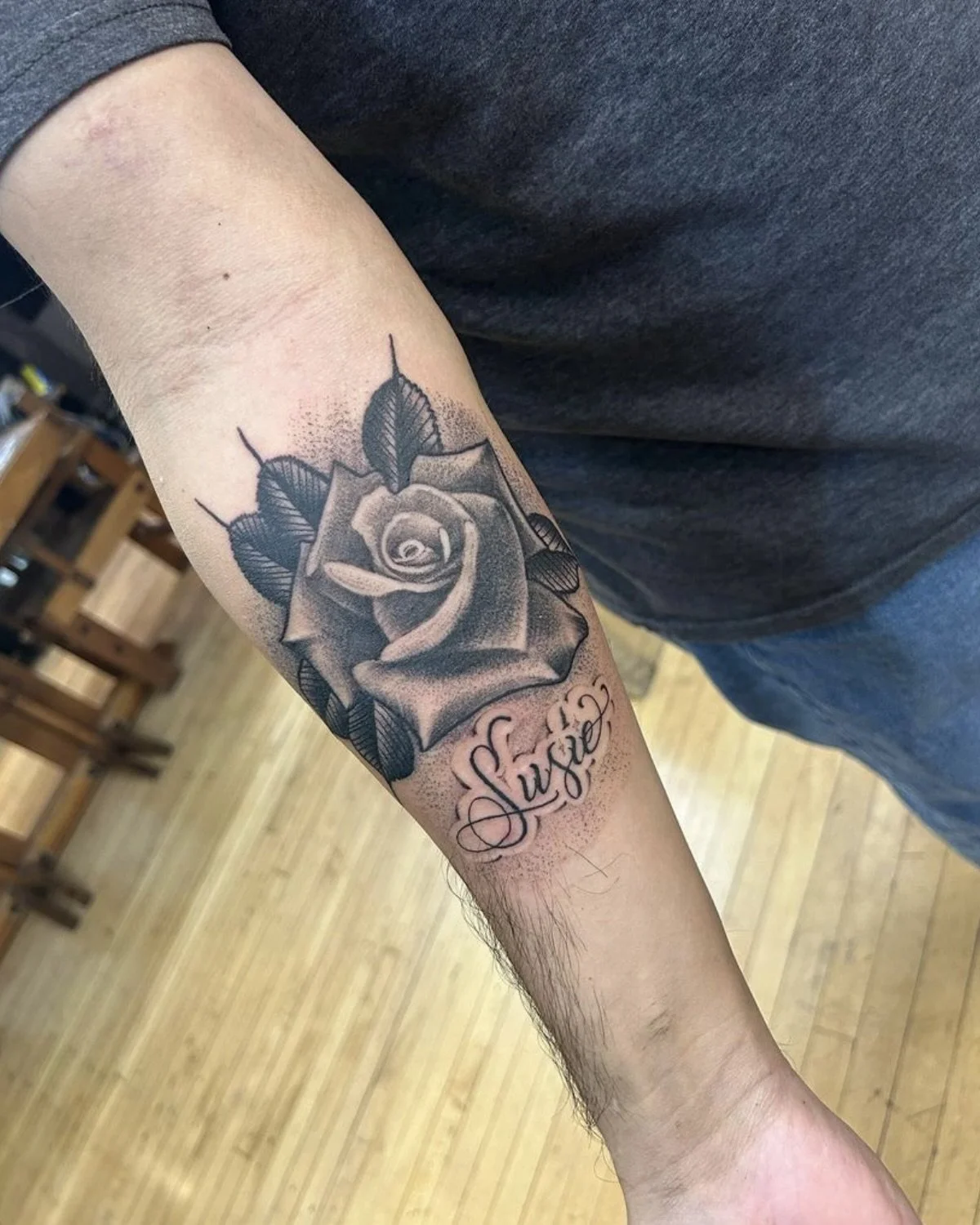 black & grey rose forearm tattoo.jpeg