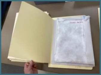 Original covers wrapped in Tyvek. The original covers were then foldered and
clamshell-boxed for long-term storage after scanning.