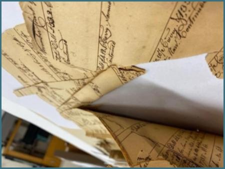 Third close-up of stuck and breaking pages.