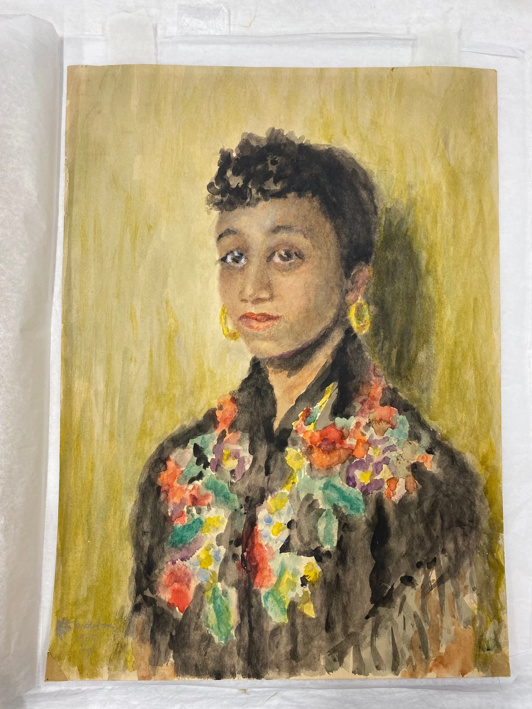 After treatment, broken paper was reinforced with reversible mends of Kozo tissue. A color-matched insert replaces the lost corner. New hinges, visible above, aid mounting. Bottom-left corner extraneous material was removed.