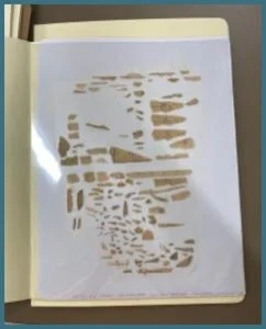 Foldered fragments are shown here ready for scanning and storage. The above
image shows fragments placed in an arrangement that places the fragments oriented all the same direction based on available chain line and letter shape clues.