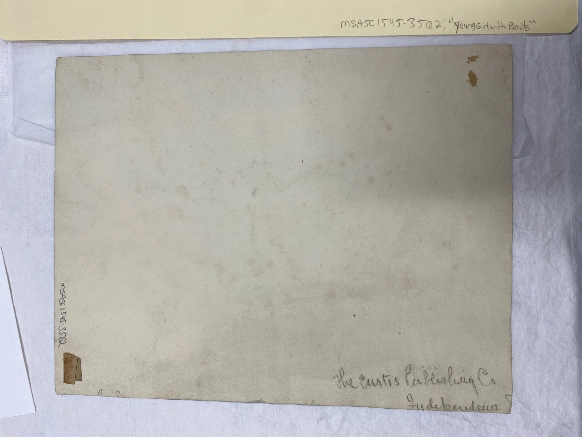 Before treatment, three-dimensional gummed taped residue remained.