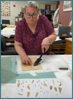 Heat set mends of small fragments with dense writing.