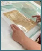 Identifying the missing corner (in Mylar sleeve) of the page.