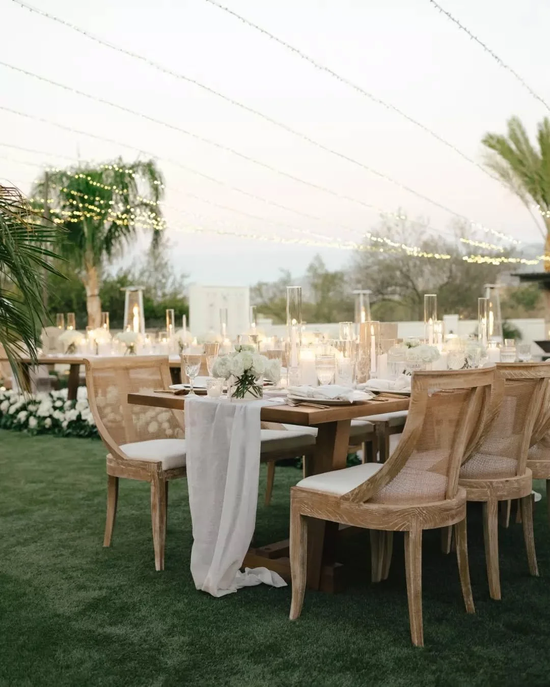 Picture this: Sunset skies, a gentle Arizona breeze, and the glow of a hundred candles turning dinner into magic. Our curated Mae Cane Back Dining Chairs and Hayden Dining Tables set the scene for this elevated affair. Swipe through to see how intent
