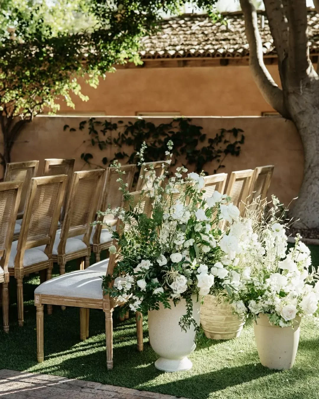 Royal Palms in the sun and our Ashley Chairs doing it all. 🕊️

We love a silhouette that makes the move from ceremony to reception feel this effortless. The cane-back detail brings that refined, residential energy we're always chasing&mdash;proving 