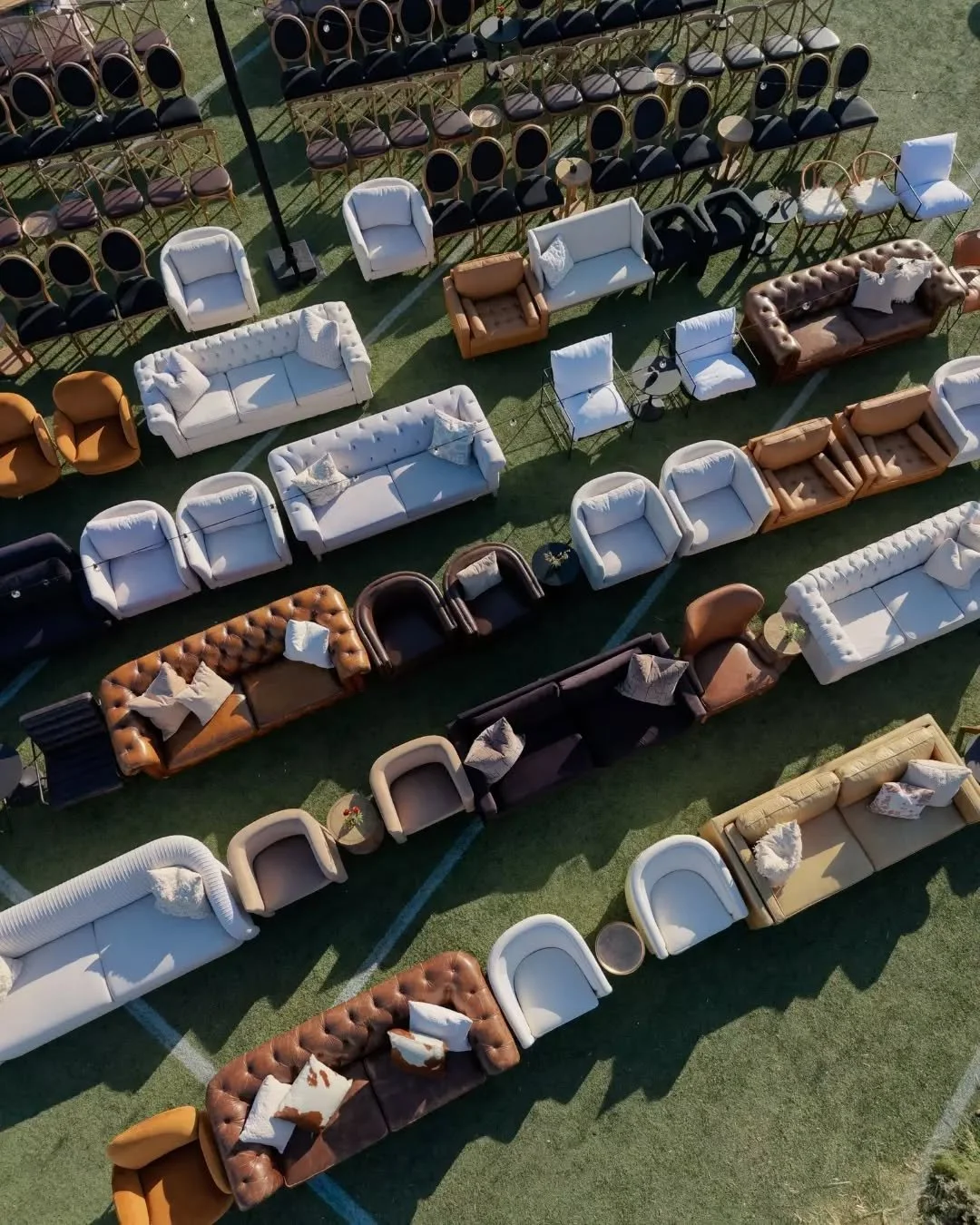 Sofas and accent chairs facing a stage. String lights overhead. Kane Brown performing just a few feet away 🤍

Prim furnished a sea of lounge seating across the performance field at Smoke &amp; Strings 2026 - sofas, leather chesterfields, accent chai