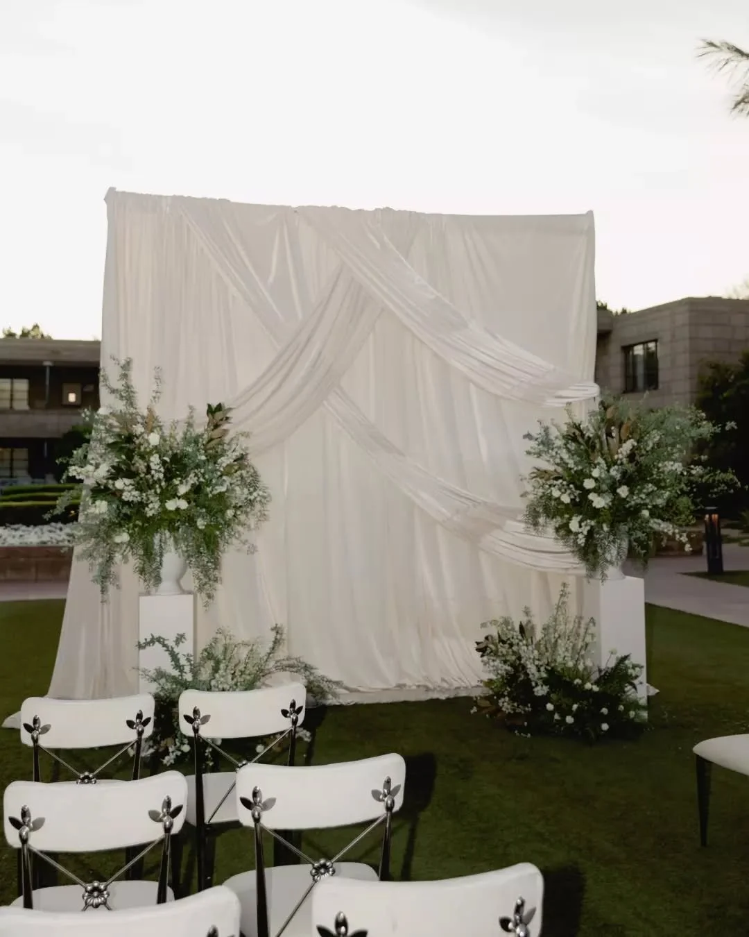 Dark linens. White draping. Regency chairs that mean business. 

This styled shoot at the Arizona Biltmore is the kind of design that reminds you just how much a color palette can shift the entire energy. Deep plum, crisp white, candlelight &mdash; a
