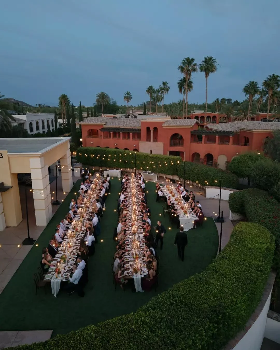 The moment the sun goes down and the candlelight takes over at @omnimontelucia - honestly one of our favorite things to watch happen ✨

Our Kingswood Harvest Dining Tables under string lights, long tables full of guests, servers weaving through the c