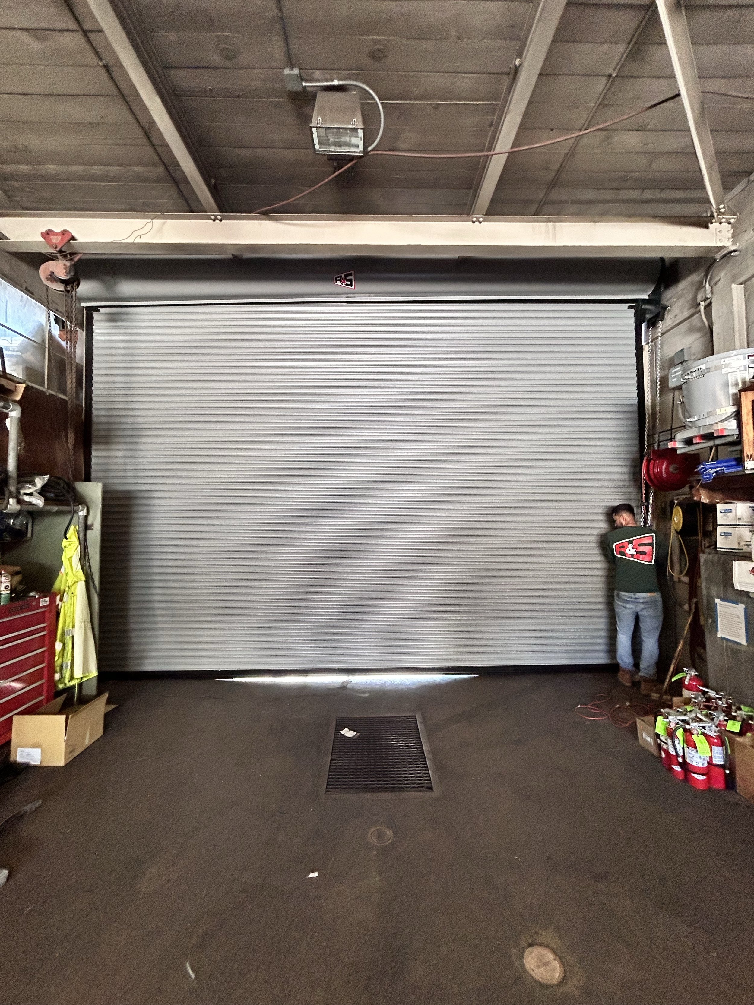 R&S San Francisco technician installing new rolling steel door