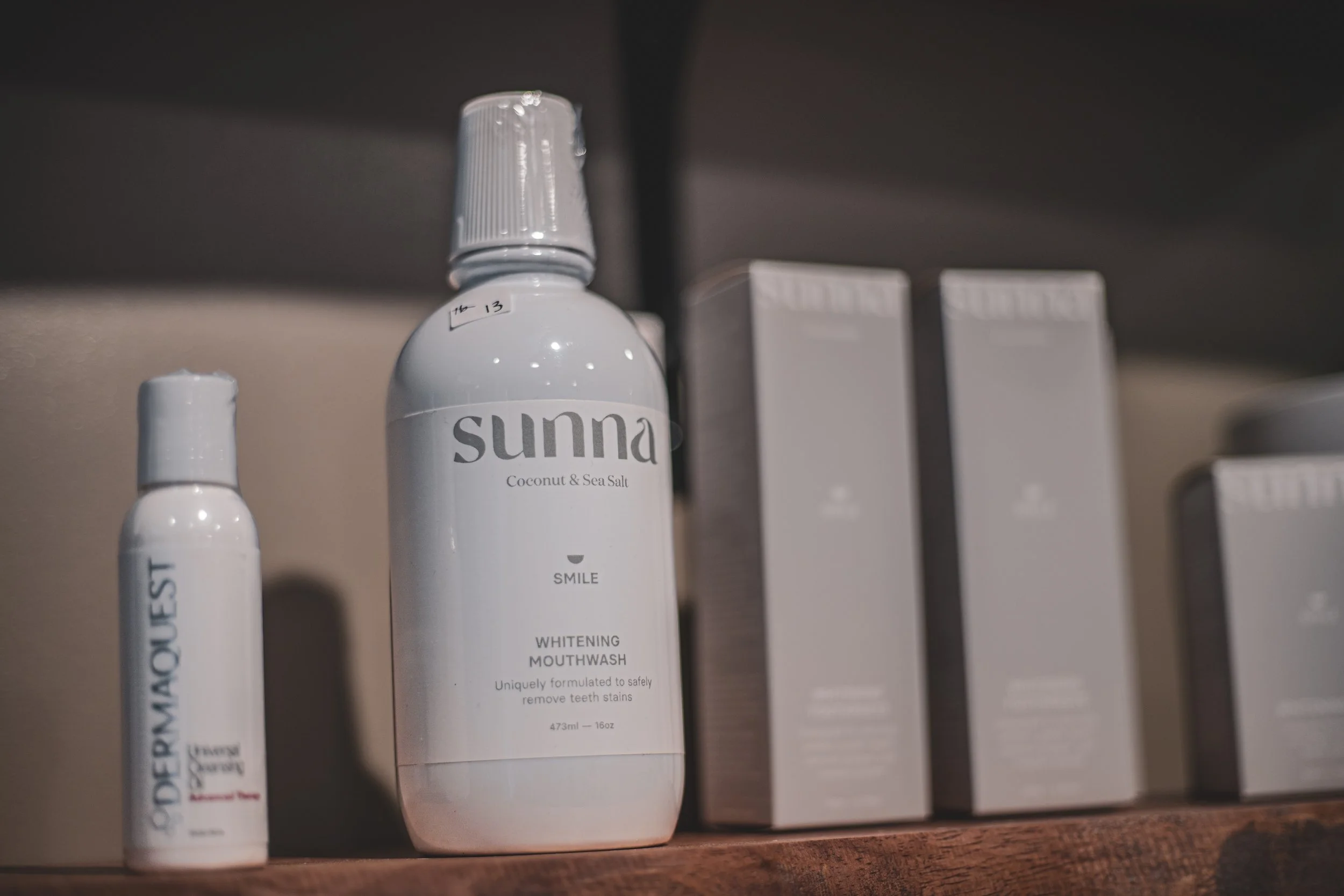 A white bottle of Sunna mouthwash on a shelf