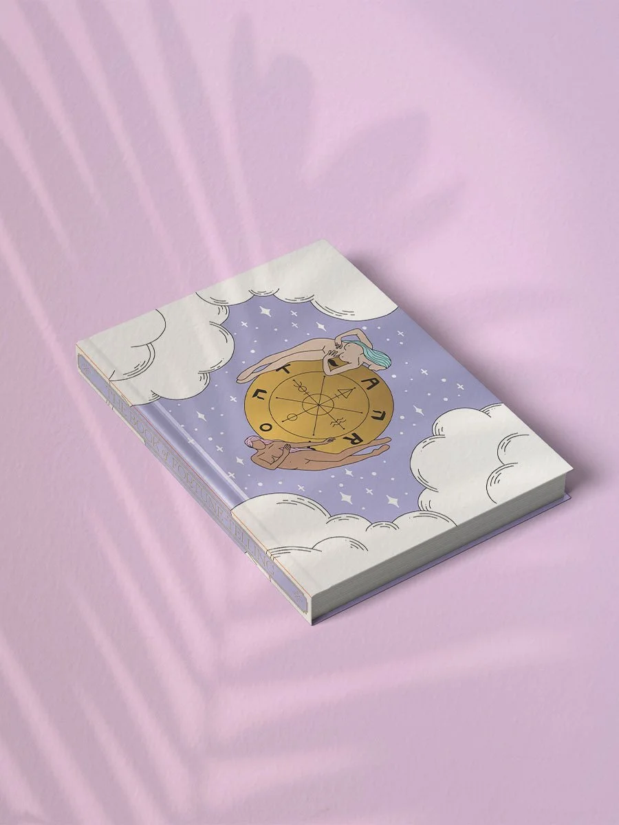 Cover illustration of the Tarot and Oracle Journal: The Book of Fortune Telling by Cosmic Valeria, featuring two hand-drawn women forming a circle around a gold Wheel of Fortune, with clouds and stars in the background.