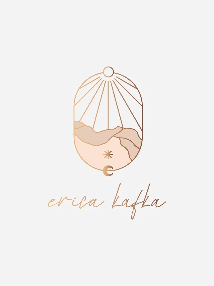 Oval mystical minimalist logo for Erika Kafka, a yoga therapist, featuring a line-drawn landscape symbolizing earth and sky, celestial elements including moon, stars, sun, sun rays, with warm rose gold palette and signature script font.