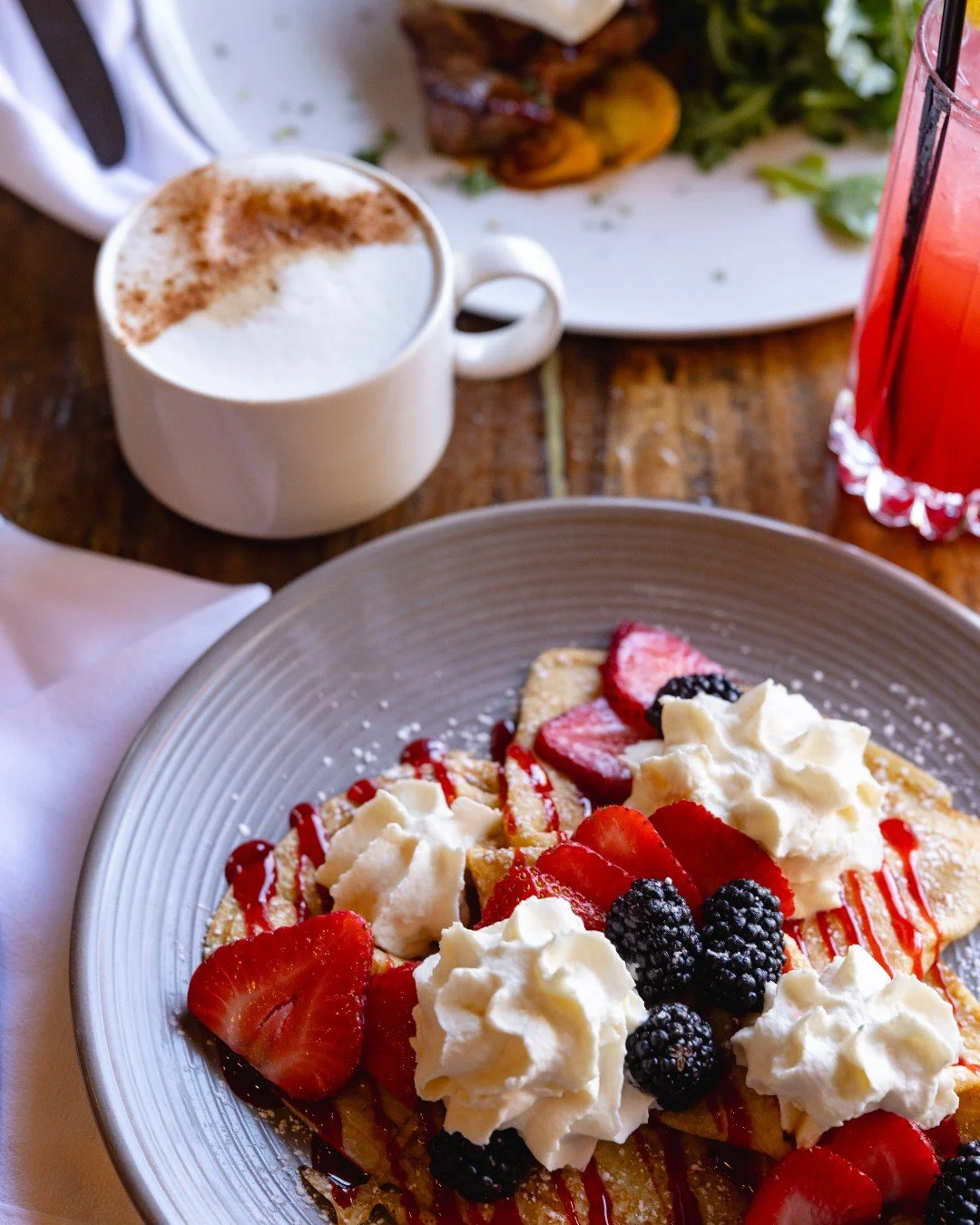 Brunch at The Living Room = weekend goals. 

From our Mixed Berry Crepe piled high with blueberries, raspberries, blackberries + whipped cream to savory favorites like Steak &amp; Eggs or Fried Chicken &amp; Waffles, there&rsquo;s something for every