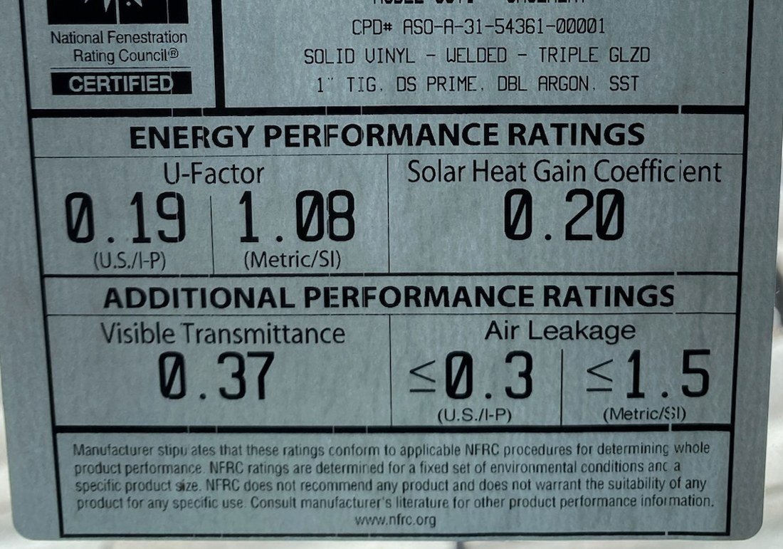 NFRC label on a triple-pane casement window showing U-factor 0.19, solar heat gain coefficient 0.20, visible transmittance 0.37, and air leakage 0.3 or less