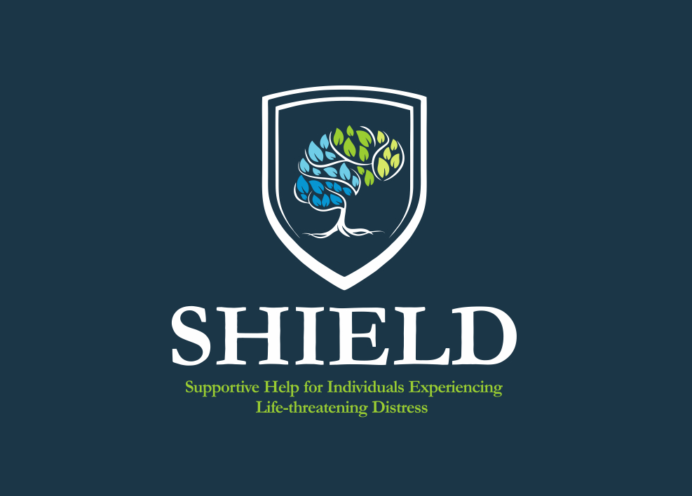 Logo for SHIELD organization featuring a shield with a stylized tree that has blue and green leaves, and the text "SHIELD" below. Subtext: "Supportive Help for Individuals Experiencing Life-threatening Distress."