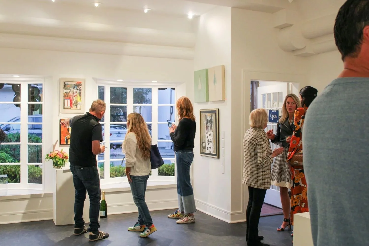 Exclusive art event and private reception at Monica Graham Fine Art in Carmel-by-the-Sea, featuring curated contemporary works and strategic advisory insights for modern collectors.