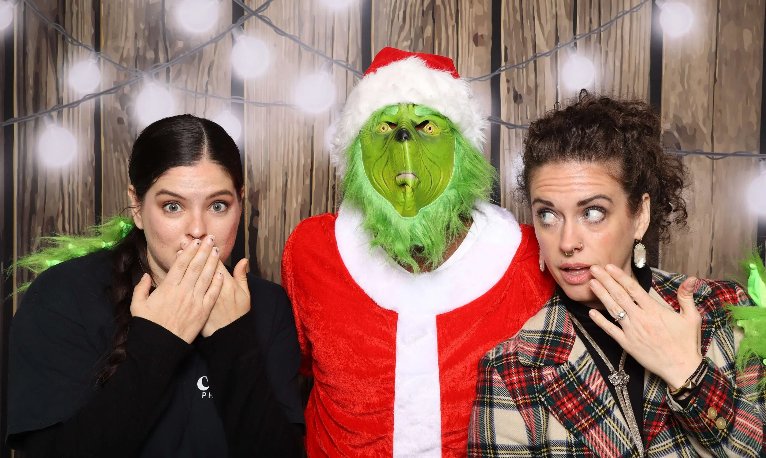 Holiday Photo Booth Memphis two women having fun with the grinch