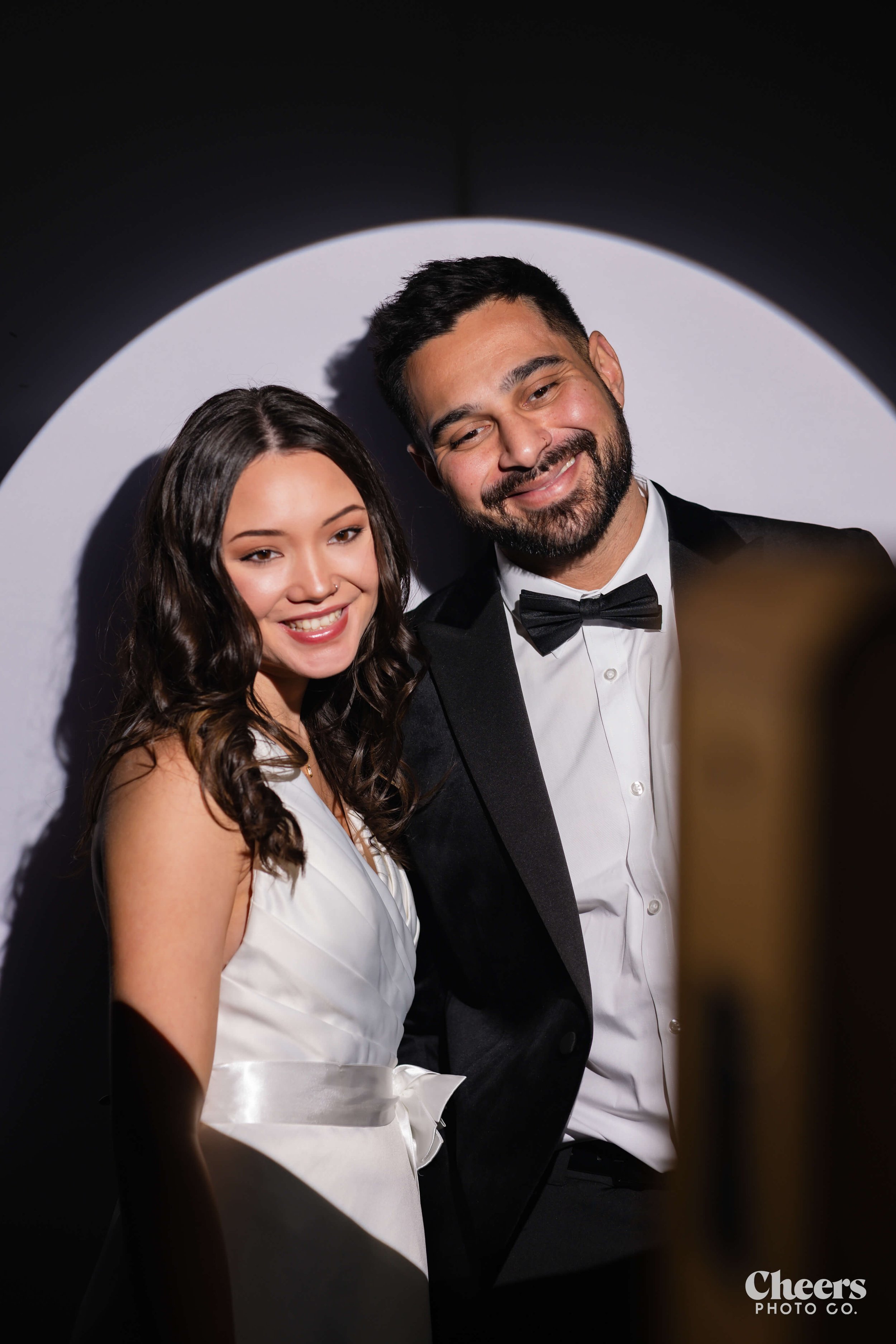 Optimized Spotlight Booth BTS Couple Smiling at Camera.jpg