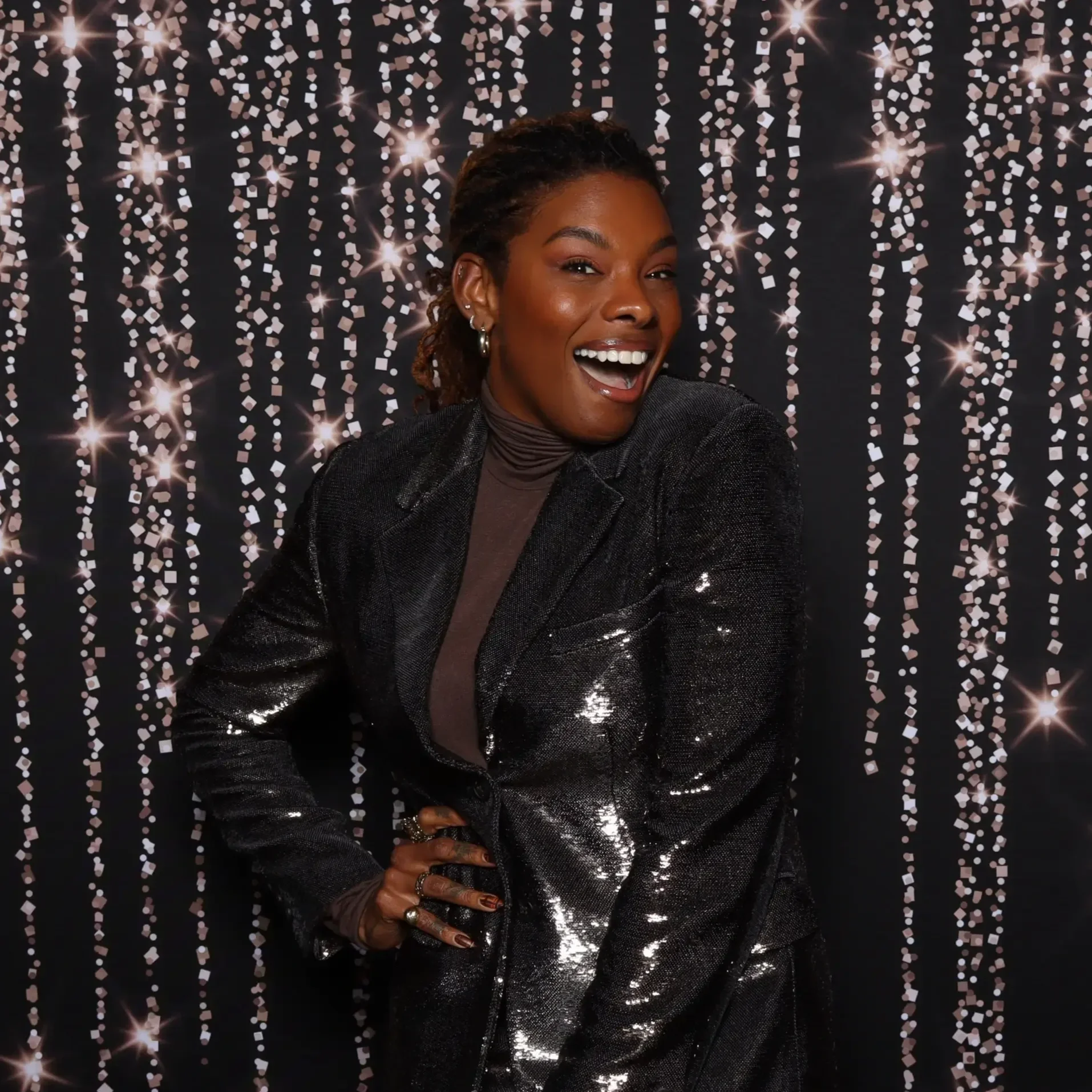 Carmeon+Hamilton+in+the+Classic+Photo+Booth+at+the+Brooks+Directors+Holiday+Party.webp