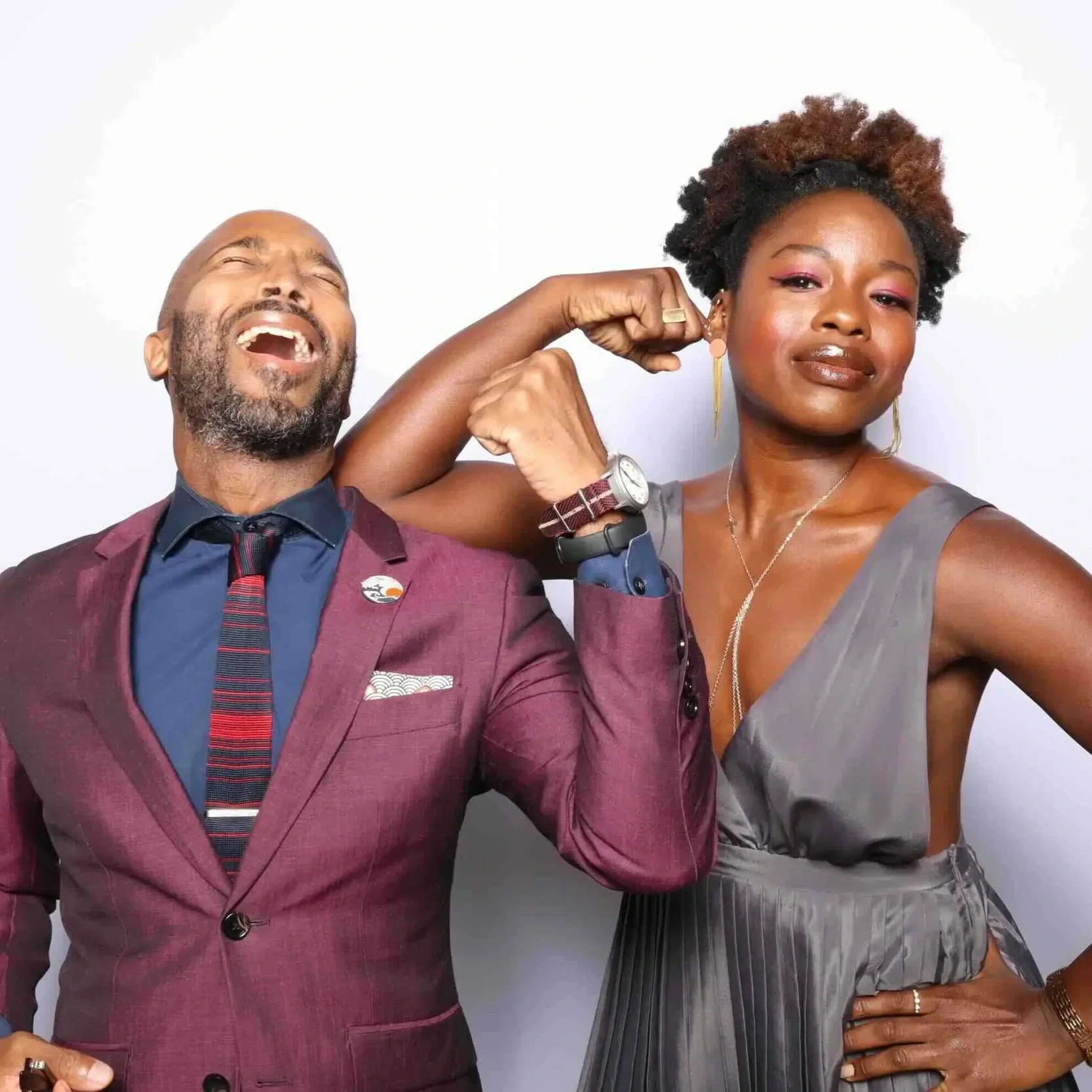 couple flexes in photo booth at olive branch wedding