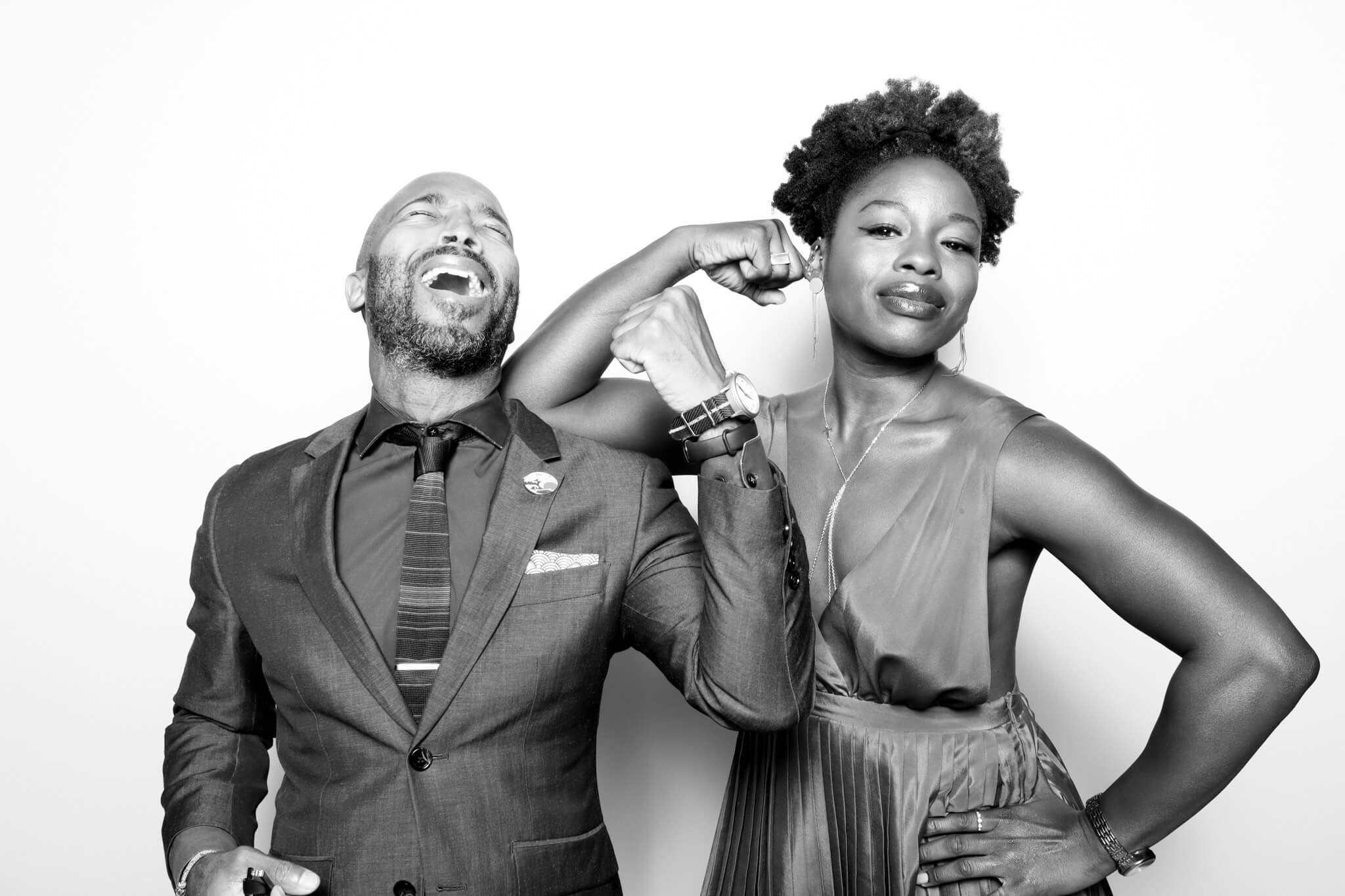 man and woman flexing for glam photo booth in Memphis