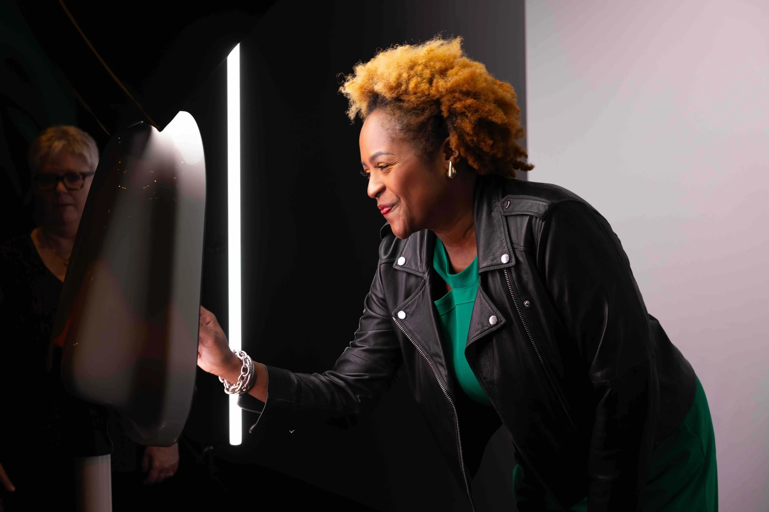 Drop Off Booth Woman Smiling at Sharing Screen.jpeg