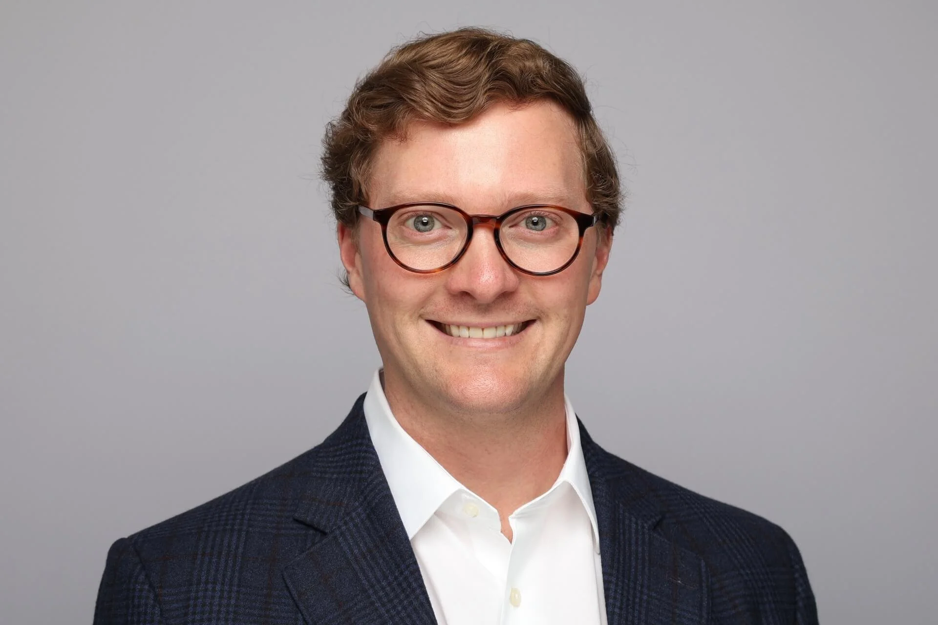 Memphis Headshot of Man in Glasses Smiling