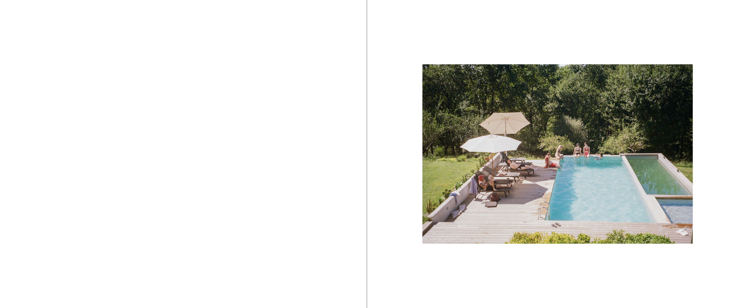 People relaxing and swimming in a backyard pool with umbrellas and lounge chairs surrounded by trees.