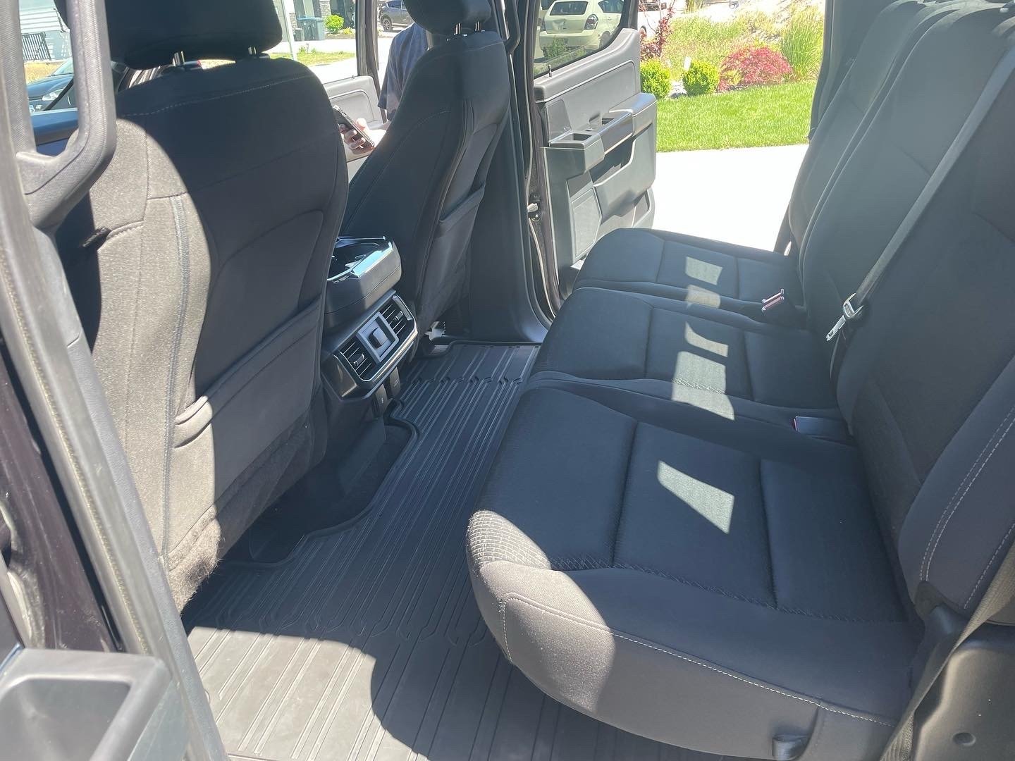 Interior of a vehicle's rear passenger seats and floor mats