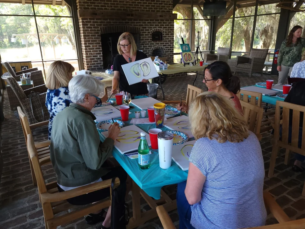 Camilla guiding participants through a creative workshop