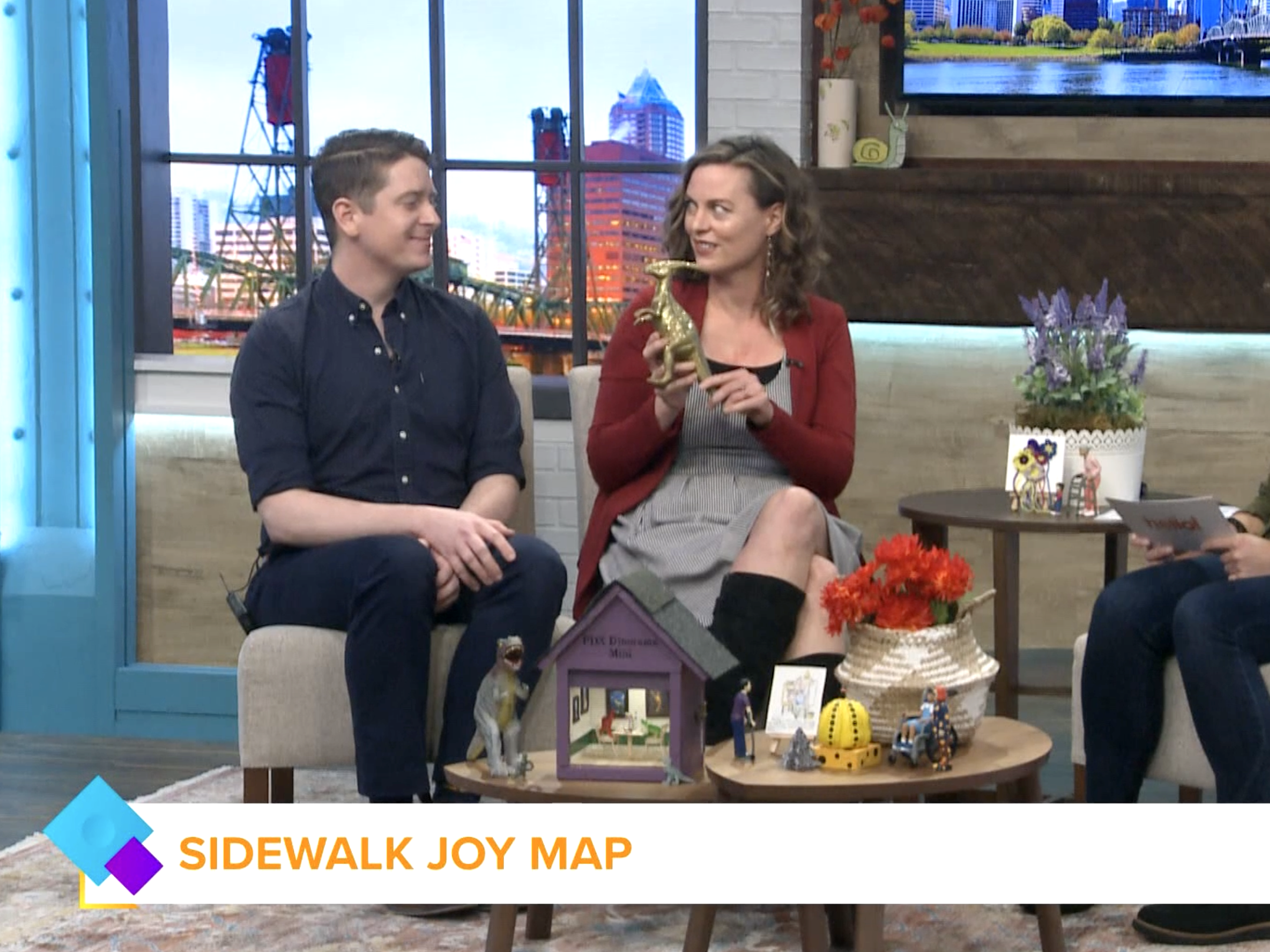 Rachael Harms Mahlandt (PDX Dinorama) and Grant Brady (PDX FLAG) smiling during Hello, Rose City segment