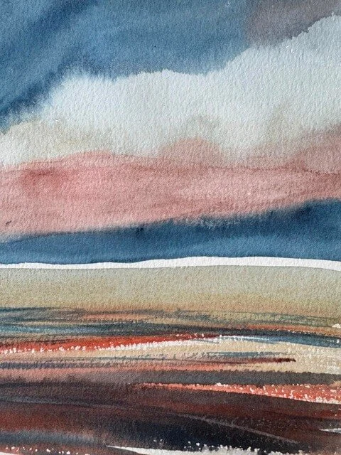 Soft, moody clouds painted in blue-gray over a warm pink sky in watercolor.