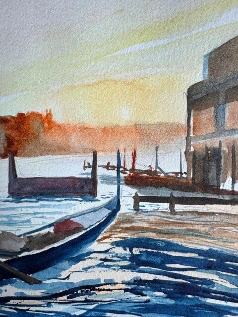 Warm-toned watercolor detail showing golden sunset light and moored gondolas near the dock in Venice